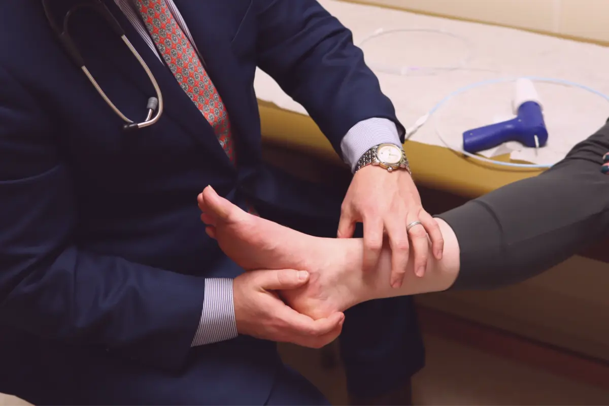 Physician examining a patient’s foot